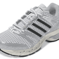 Adidas Big Kids Adistar Control 5 grade school white and silver sneakers, side view showing sporty design and brand logo.