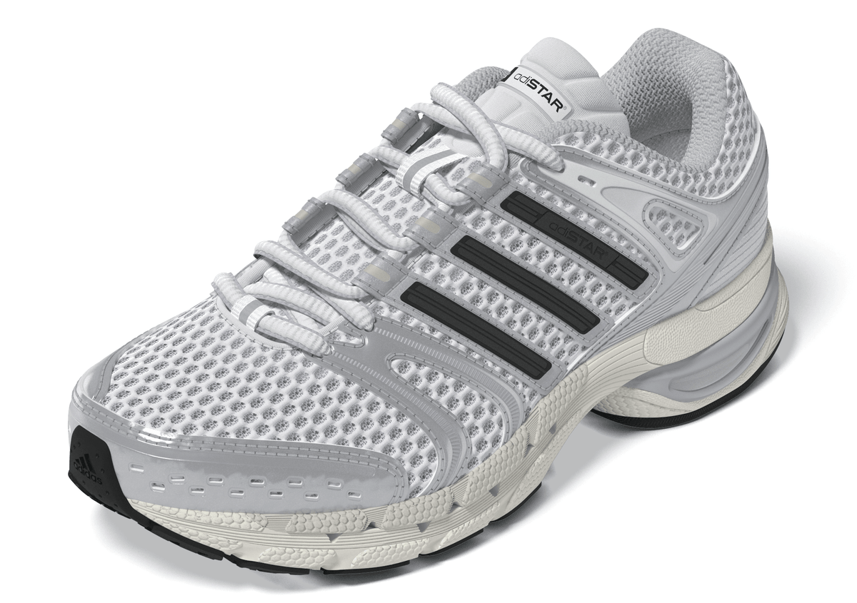 Adidas Big Kids Adistar Control 5 grade school white and silver sneakers, side view showing sporty design and brand logo.