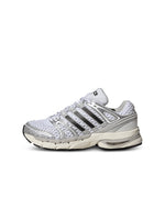 White and silver Adidas Big Kids Adistar Control 5 gradeschool footwear side view showing sporty design and supportive sole
