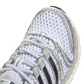 White and silver Adidas Big Kids Adistar Control 5 gradeschool athletic shoes with detailed stitching and Nike branding.