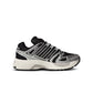 Black and silver Adidas Big Kids Adistar Control 5 gradeschool athletic footwear, side medial center view.