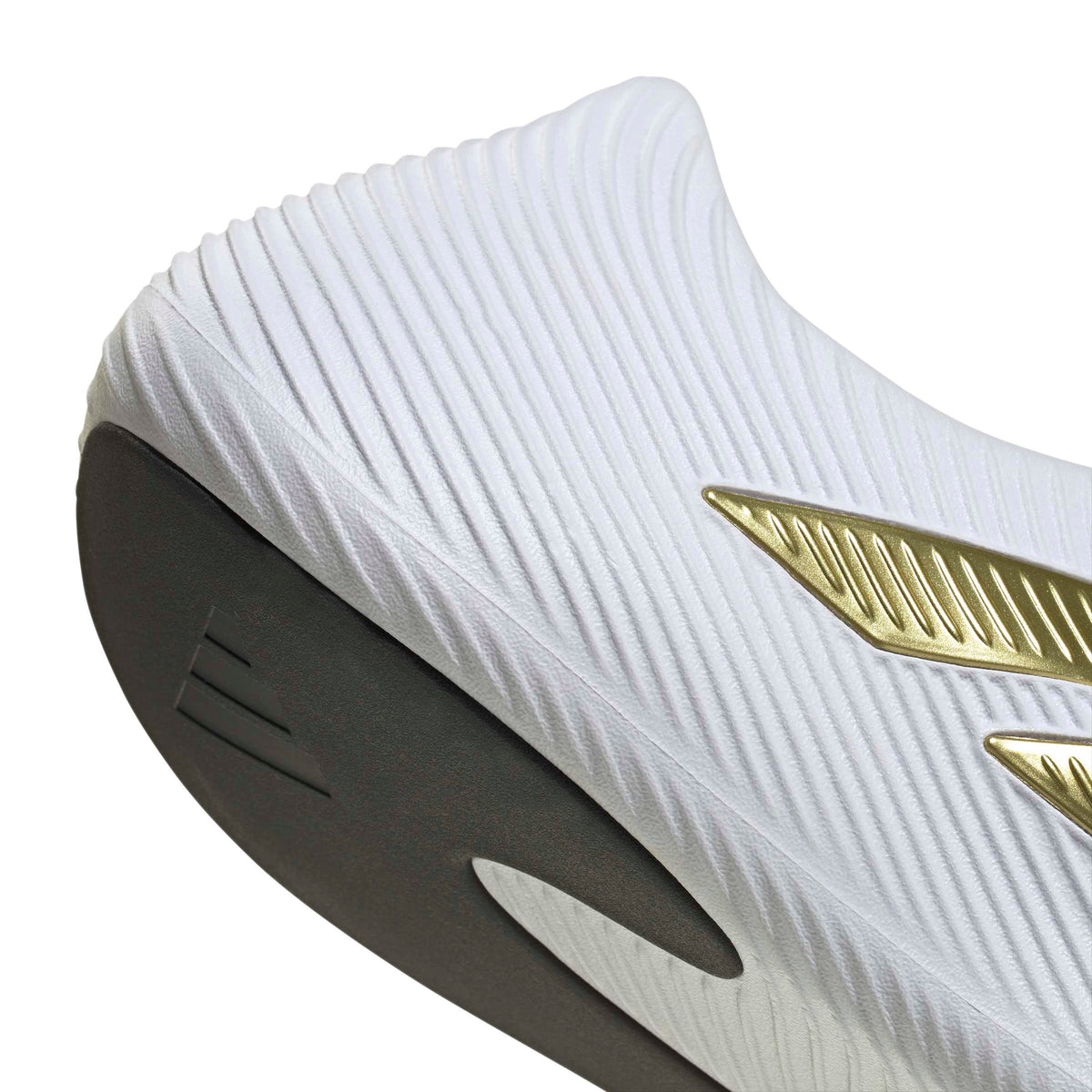 Adidas men's Purechill white and gold footwear with detailed view showing sleek design and comfortable fit.