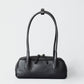 HYER GOODS Mini La Strada East West Shoulder Bag in black with silver accents, showcasing its compact design and stylish details.