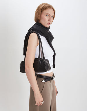 HYER GOODS Mini La Strada East West Shoulder Bag in black with silver accents, showcasing its compact design and adjustable strap.