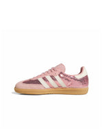 Pink Adidas Women's Samba OG footwear with white accents, side medial view showcasing classic sneaker design and textured upper.