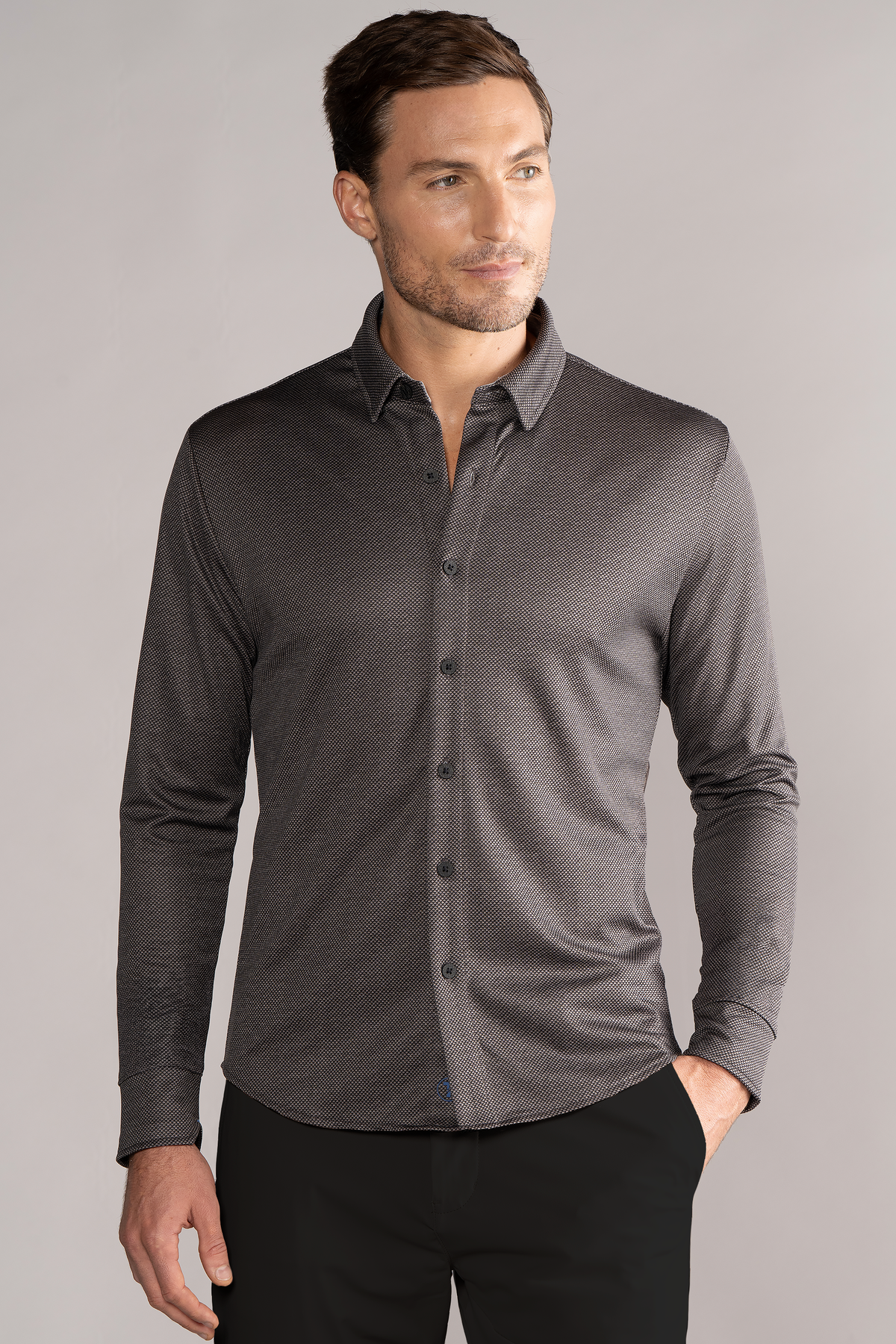 Grey long sleeve button-down polo shirt with dot pattern by Twillory, shown from front on a model.