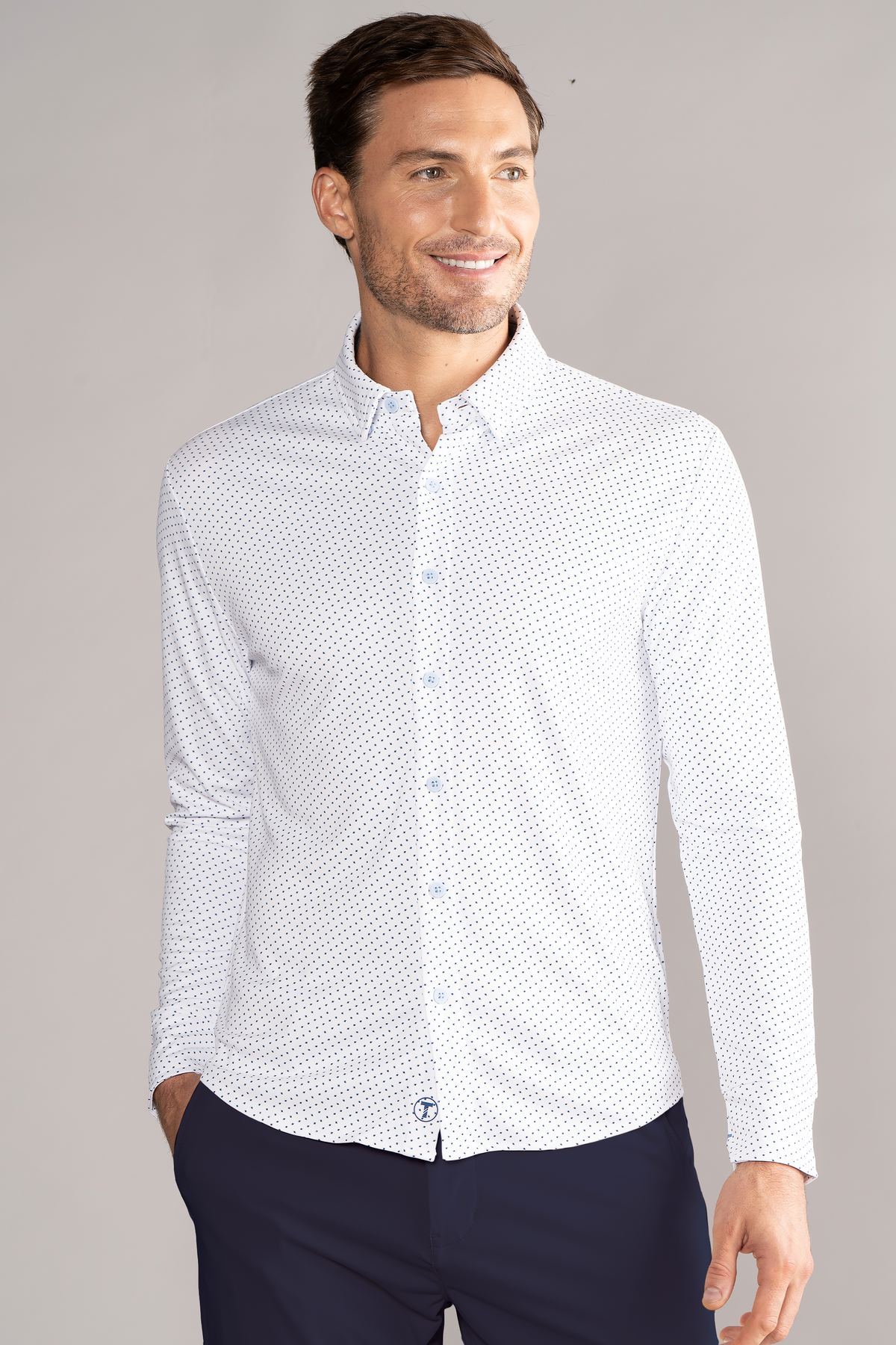 Navy long sleeve button-down polo shirt with white dot pattern from Twillory, styled on a mannequin.