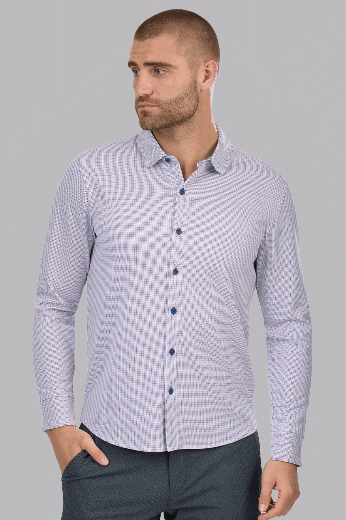 Twillory long sleeve button-down polo shirt with orange and blue dot pattern, featuring a classic collar and front button closure.