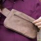 Shield Your Body SYB Metro vegan leather cross body fanny pack worn as a mobile phone accessory