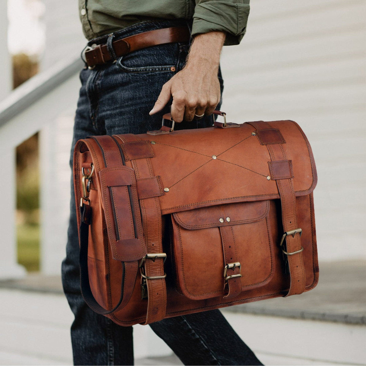 Classy Leather Bags Griffin Crossbody Messenger Bag shown in a lifestyle setting with adjustable strap and sleek design.