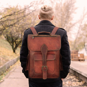 Rustic brown leather backpack from Classy Leather Bags, featuring adjustable straps and multiple compartments for everyday use.