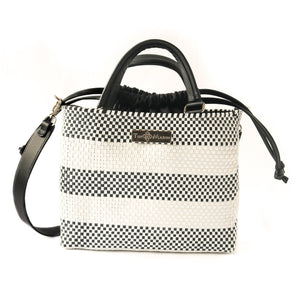 Black Lolo medium woven crossbody bag with drawstring closure and adjustable strap, made by Tin Marin Brand.