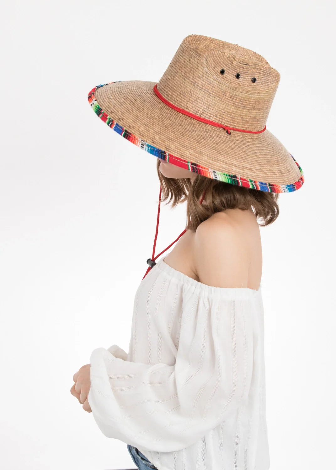 Peter Grimm Luz straw lifeguard hat in natural woven design with wide brim and chin cord