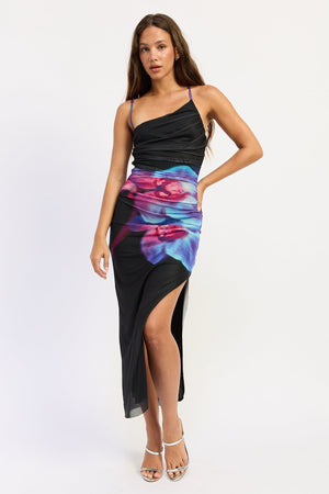 Black floral Emmeline midi dress by Emory Park, featuring a fitted waist and flowing skirt, showcased on a model.