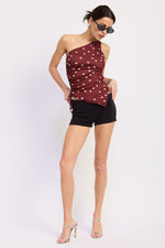Emory Park Maya Top in maroon polka dot fabric, stylish blouse with ruffled neckline and puff sleeves for a trendy look.