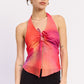Emory Park Evania halter top in vibrant orange fuchsia, featuring a stylish sleeveless design and tie-front detail.