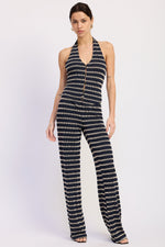 Navy and cream Anwen halter top by Emory Park featuring a fitted design and stylish neckline, displayed on a hanger.