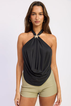 Black Virelle halter top by Emory Park, featuring a stylish design with a halter neckline and modern sleeveless style.