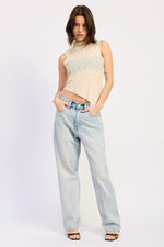 Emory Park Abigail Ivory top displayed on a hanger with a soft, flowy fabric and subtle detailing suitable for casual or dressy occasions.