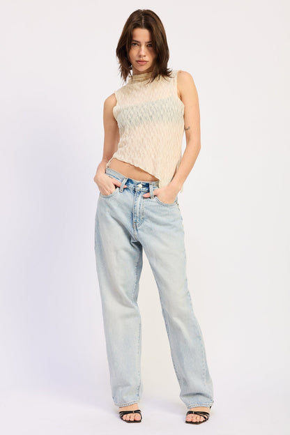 Emory Park Abigail Ivory top displayed on a hanger with a soft, flowy fabric and subtle detailing suitable for casual or dressy occasions.