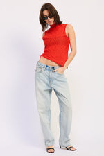 Red Abigail top from Emory Park, a stylish women's blouse with a relaxed fit and soft fabric, displayed on a hanger.