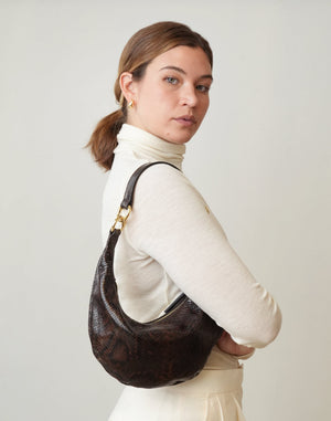 Dark brown python micro ring hobo bag by HYER GOODS with a sleek, compact design and top handle.