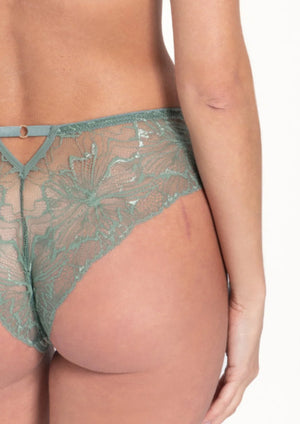 Lavinia Samanta Mila sage lace tanga panty with delicate floral design and slim fit, shown on a model.