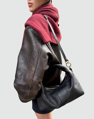 HYER GOODS Mini Everyday Shoulder Bag in black with gold accents, shown on a grey background, showcasing its compact design.