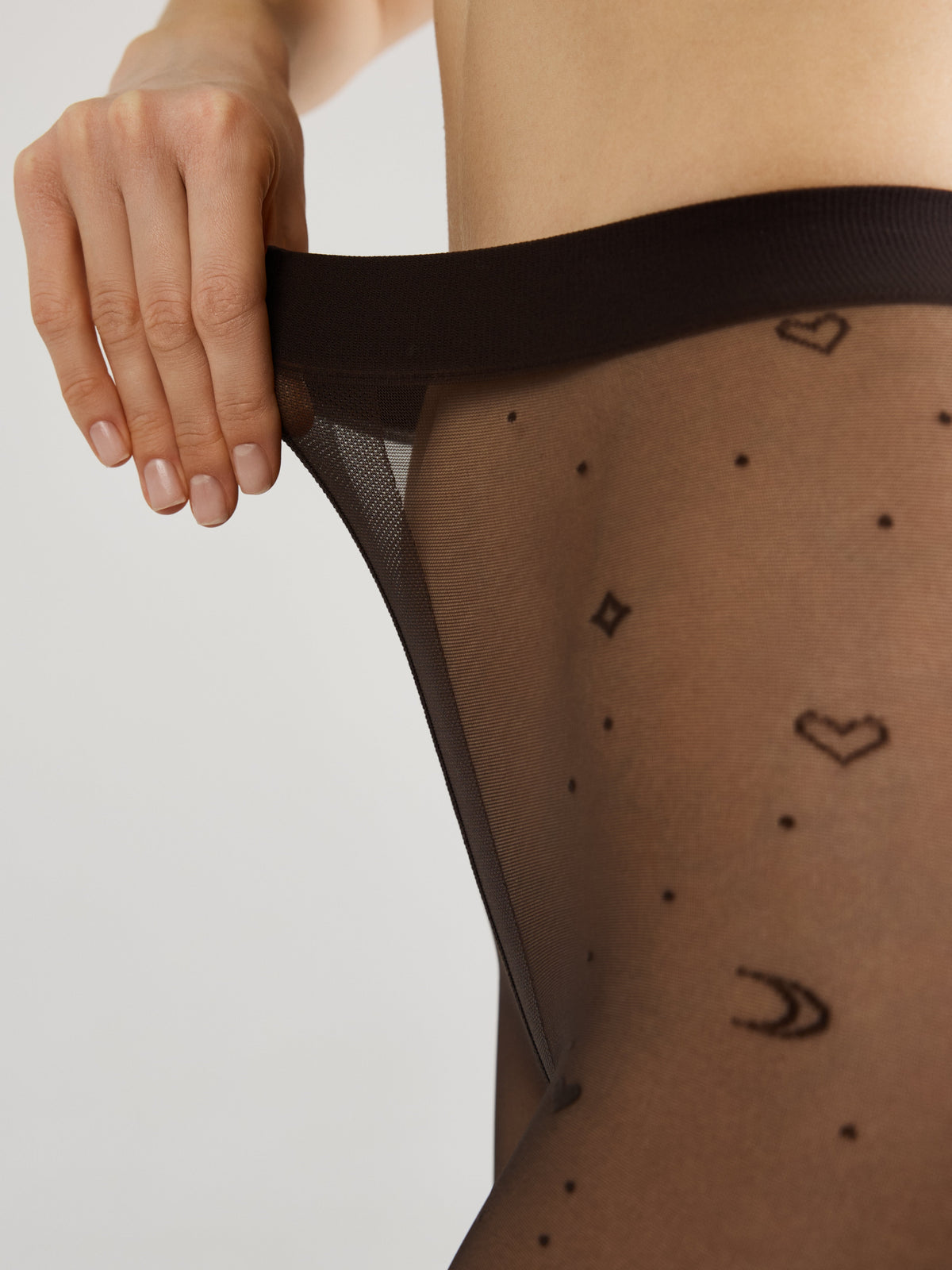 Women's fantasy tights featuring moon patterns in graphite, designed by TheRanok.com, with detailed celestial moon design on black fabric.