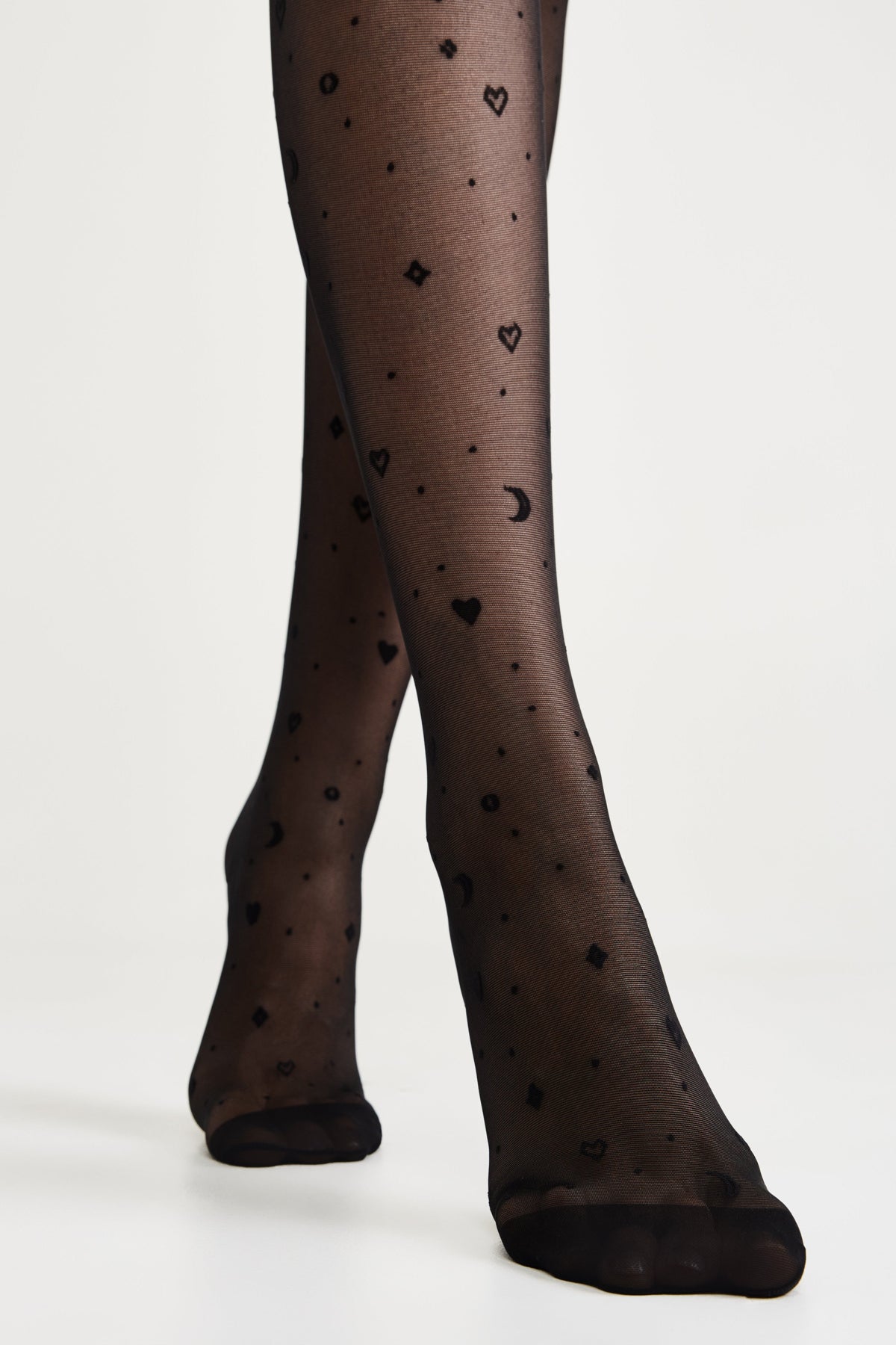 Women’s fantasy tights featuring moon patterns, black and white design, by TheRanok.com, showcasing the detailed moon print.