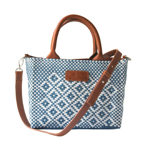 Marine small woven crossbody bag by Tin Marin Brand in camel color, featuring a compact design with woven texture and adjustable strap.