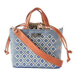 Medium woven crossbody bag with drawstring closure by Tin Marin Brand, showcasing its stylish woven design and adjustable strap.