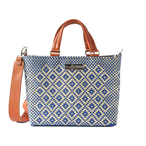Medium woven crossbody bag with drawstring closure by Tin Marin Brand, featuring a textured fabric and adjustable strap.