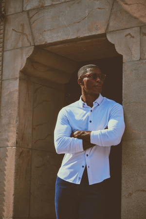 Men's long sleeve button-down polo shirt in white with navy contrast from Twillory, featuring a classic collar and button front.
