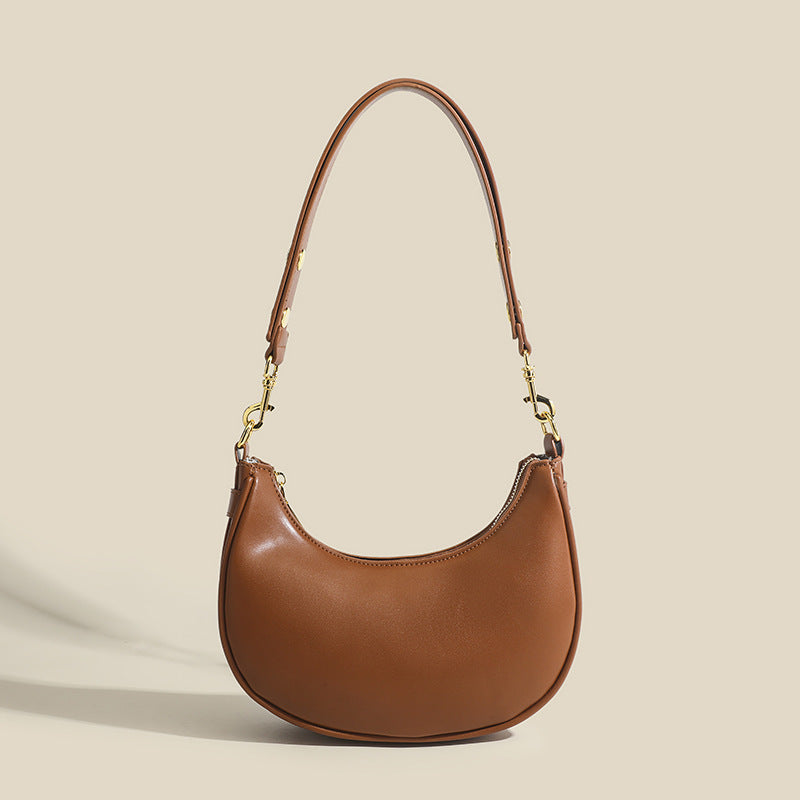 Textured light luxury crescent moon shoulder bag by Rirati featuring retro underarm design and stylish details.