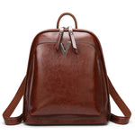 Women's leather fashion oil wax cowhide vintage backpack with adjustable straps and top handle by Rirati.