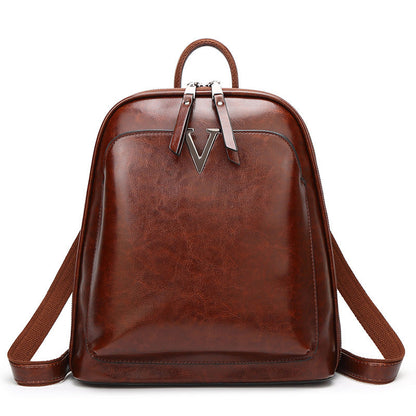 Women's leather fashion oil wax cowhide vintage backpack with adjustable straps and top handle by Rirati.