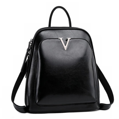 Women's leather vintage backpack by Rirati, made from oil wax cowhide with stylish, durable design and multiple compartments.