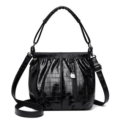 Women’s elegant slouchy fashion shoulder bag by Rirati, featuring a chic pouch design with soft, stylish leather material.