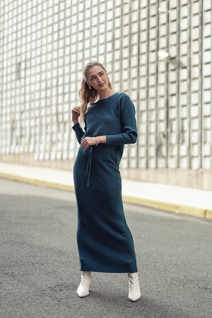 Teal ribbed sweater skirt by Adina Las Vegas, featuring a fitted design and soft knit fabric for a stylish look.
