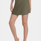 Trophy Yoga built-in pocket tennis skort in lightweight fabric, featuring a classic white design and comfortable fit.