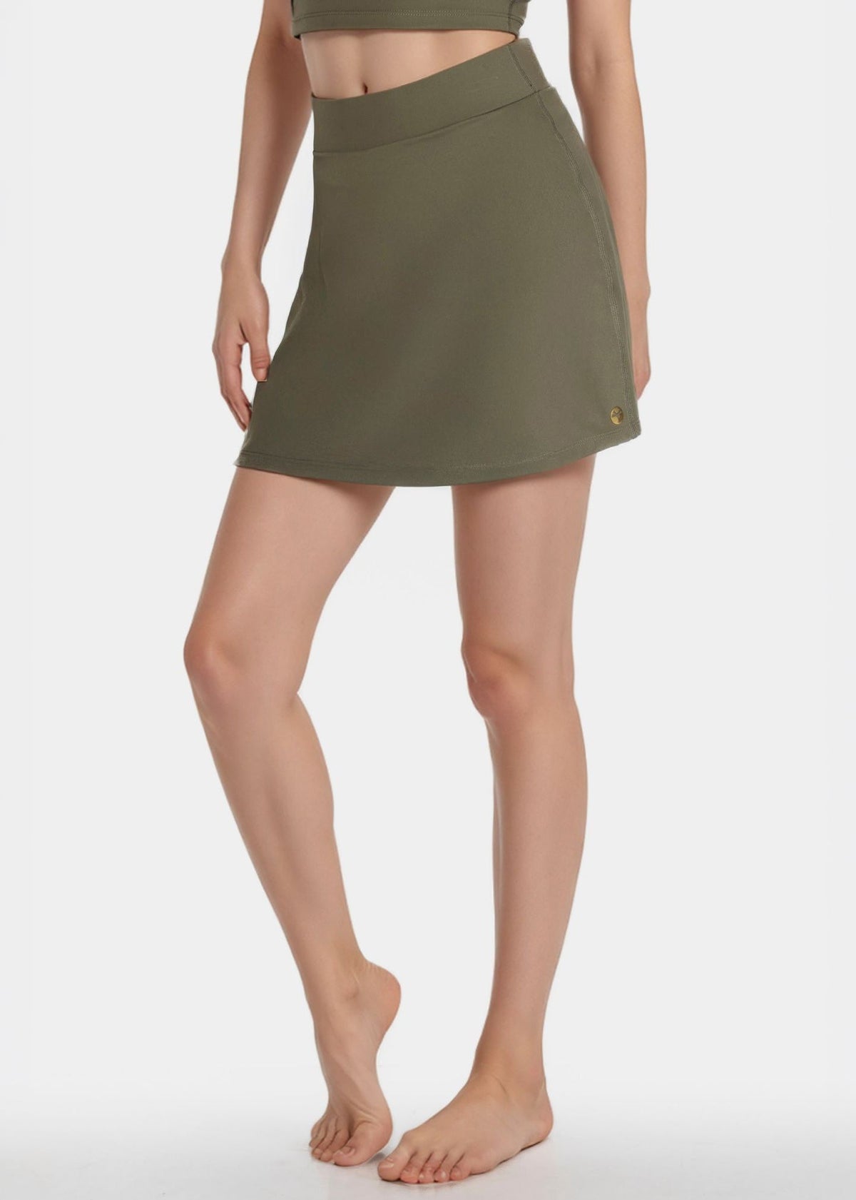 Trophy Yoga built-in pocket tennis skort in lightweight fabric, featuring a classic white design and comfortable fit.