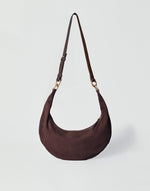 HYER GOODS Piccola Ring Bag hobo bag in chocolate suede with circular handle and compact design, stylish and versatile accessory.