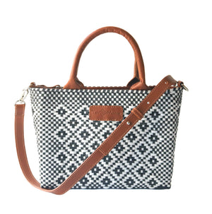Camel-colored small woven crossbody bag featuring a panda design from Tin Marin Brand, perfect for casual wear.