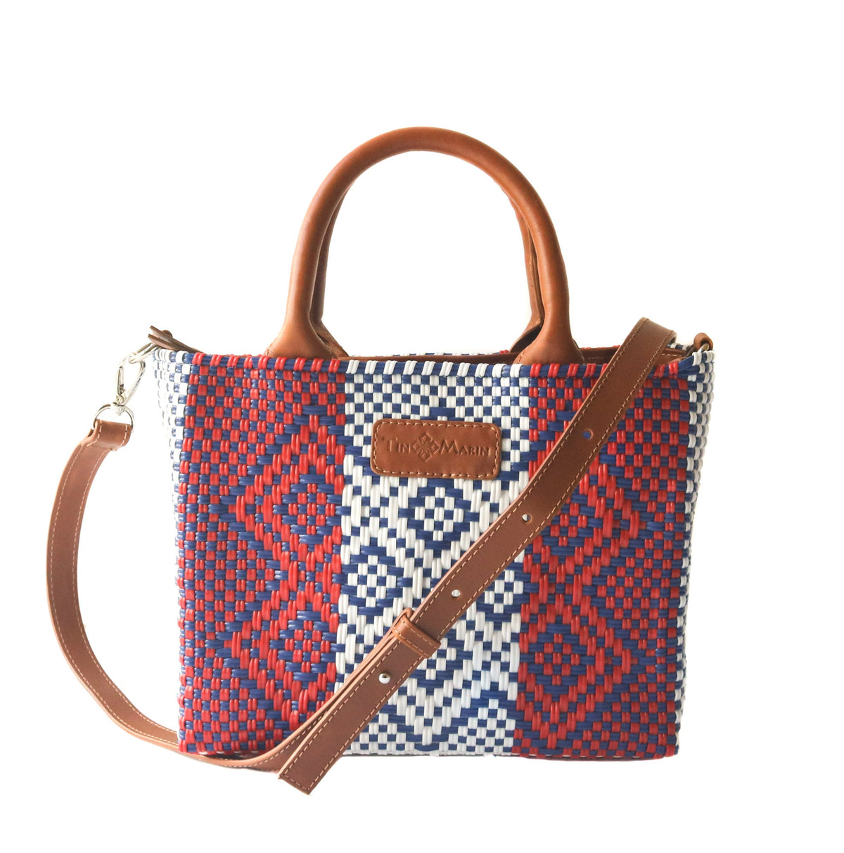 Small woven crossbody bag in camel color by Tin Marin Brand, featuring a compact design with a woven texture.