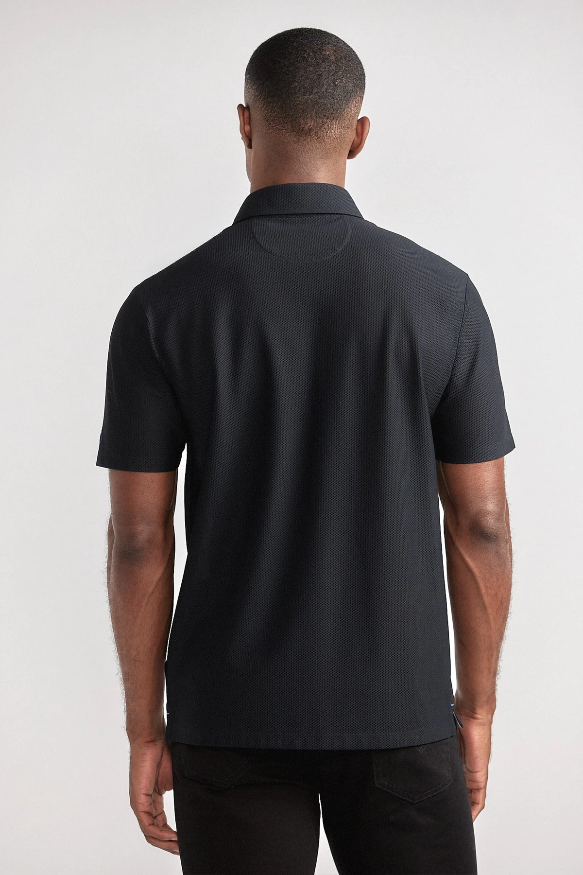 Black AIR 3 Button Polo shirt by Twillory, casual men's polo with a back view and classic collar.