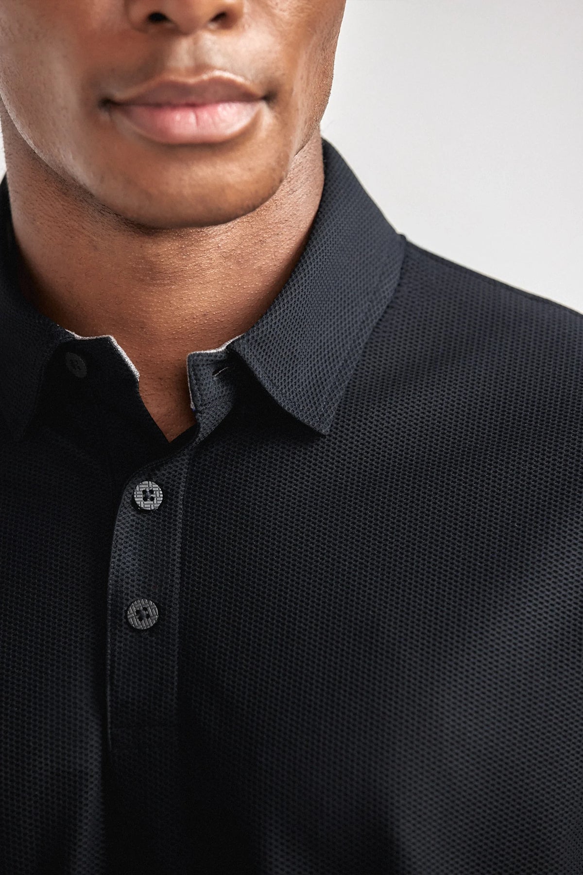 Black AIR 3-button polo shirt by Twillory, casual men's shirt with a classic collar and smooth fabric.