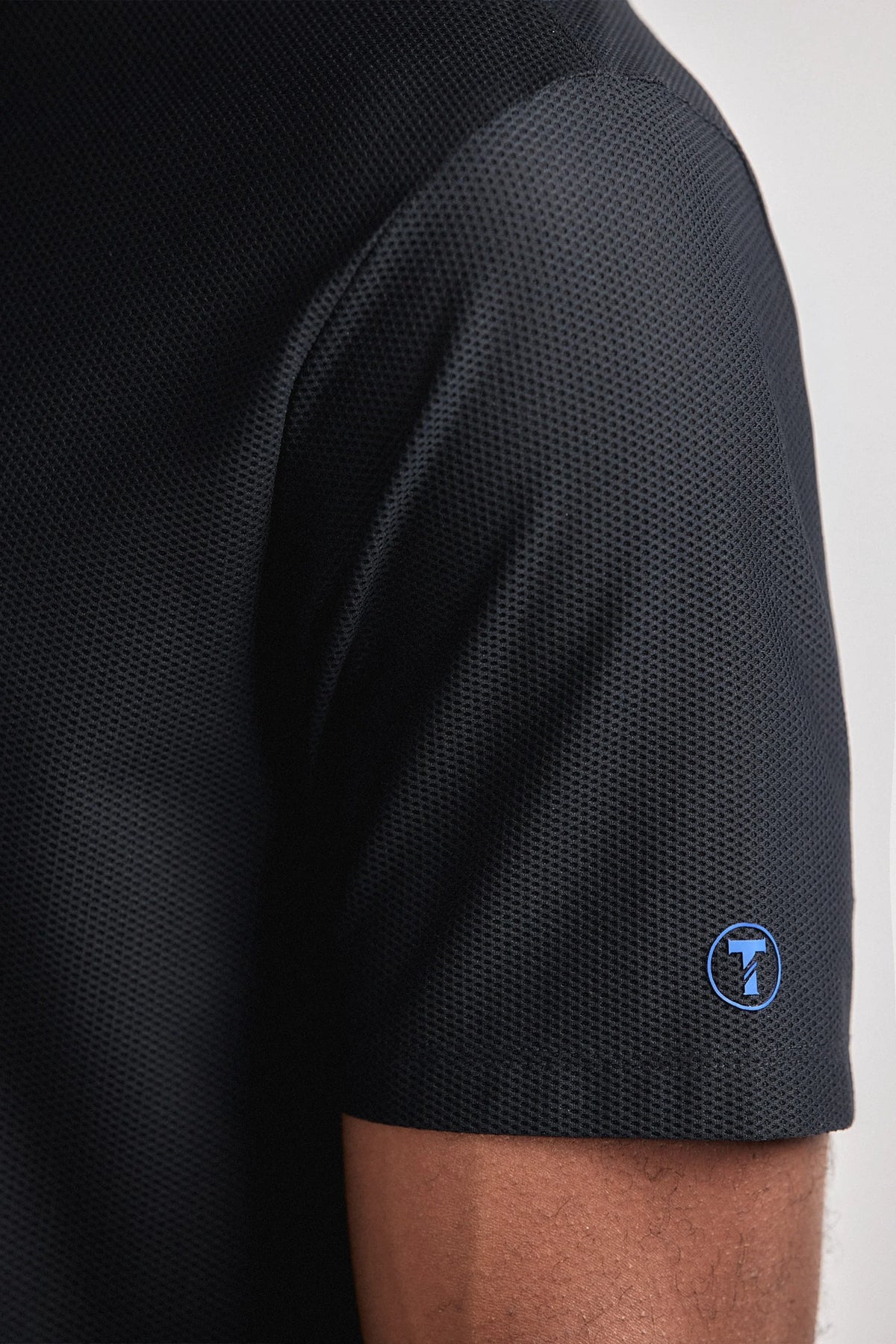 Black AIR 3 Button Polo from Twillory featuring a casual short-sleeve design and classic collar, perfect for everyday wear.
