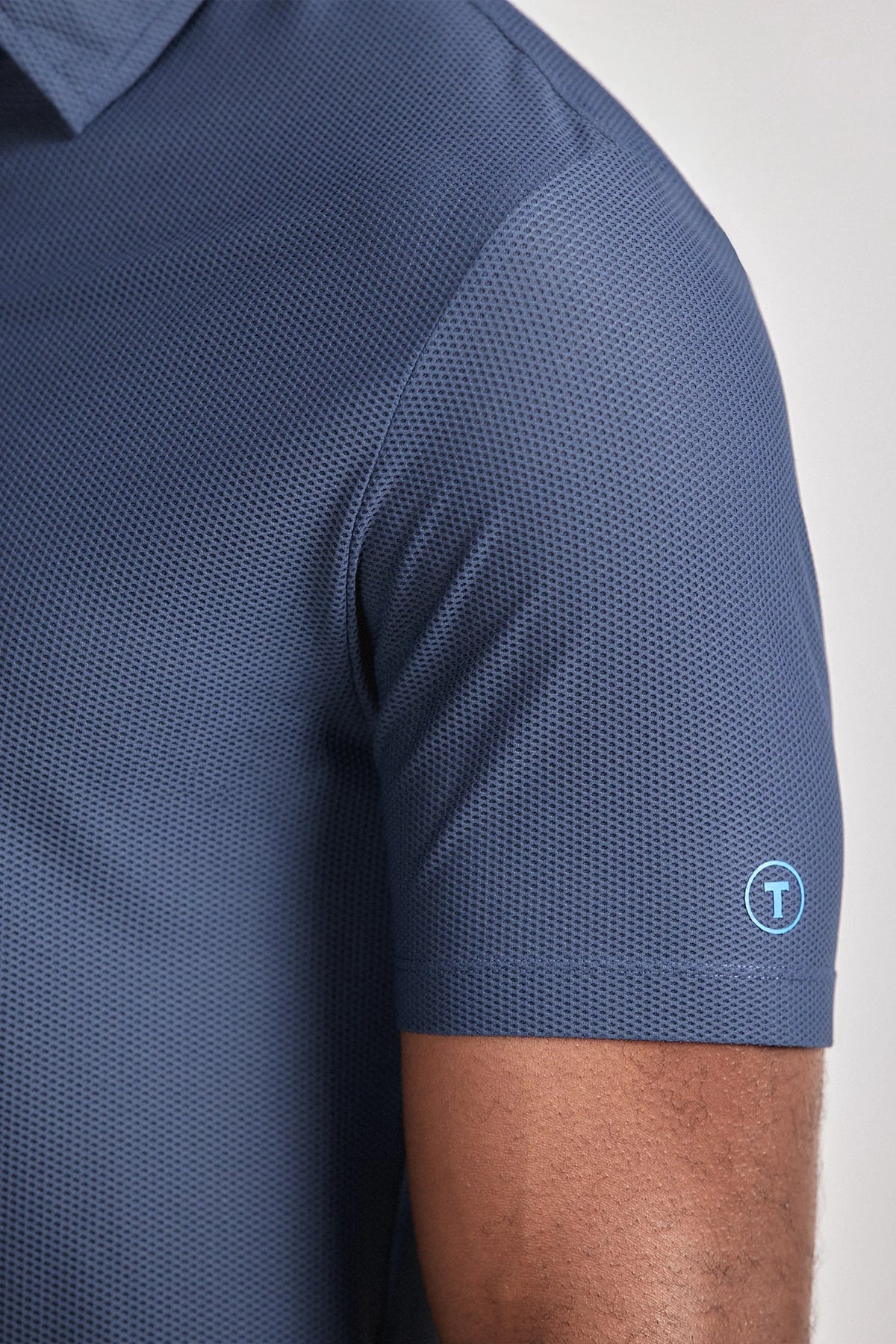 Navy AIR 3 Button Polo Solid by Twillory, casual short-sleeve shirt with classic collar and button placket, displayed on a mannequin.