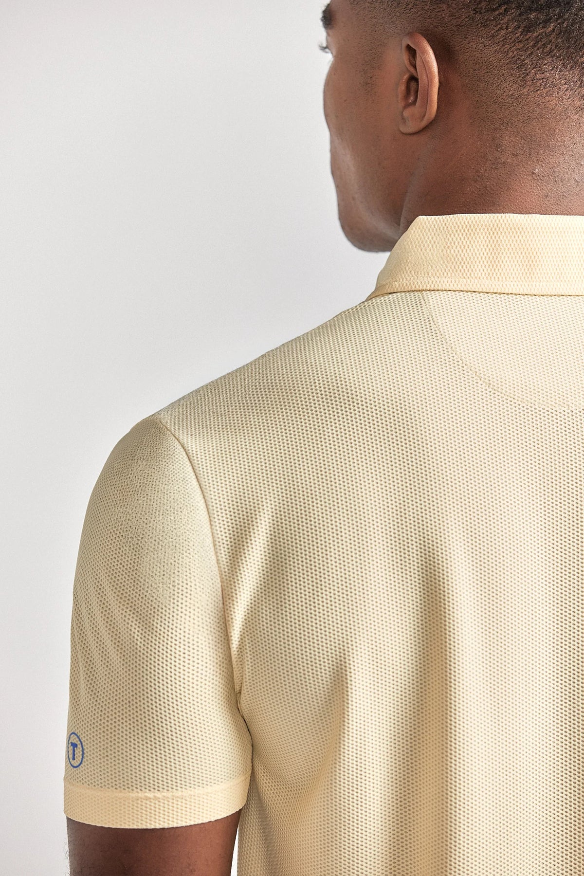 Yellow AIR 3 Button Polo by Twillory, casual men's shirt with short sleeves and classic fit, shown on a mannequin.